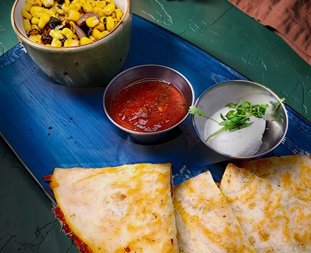 half chicken quesadilla with fire-roasted corn, salsa and sour cream